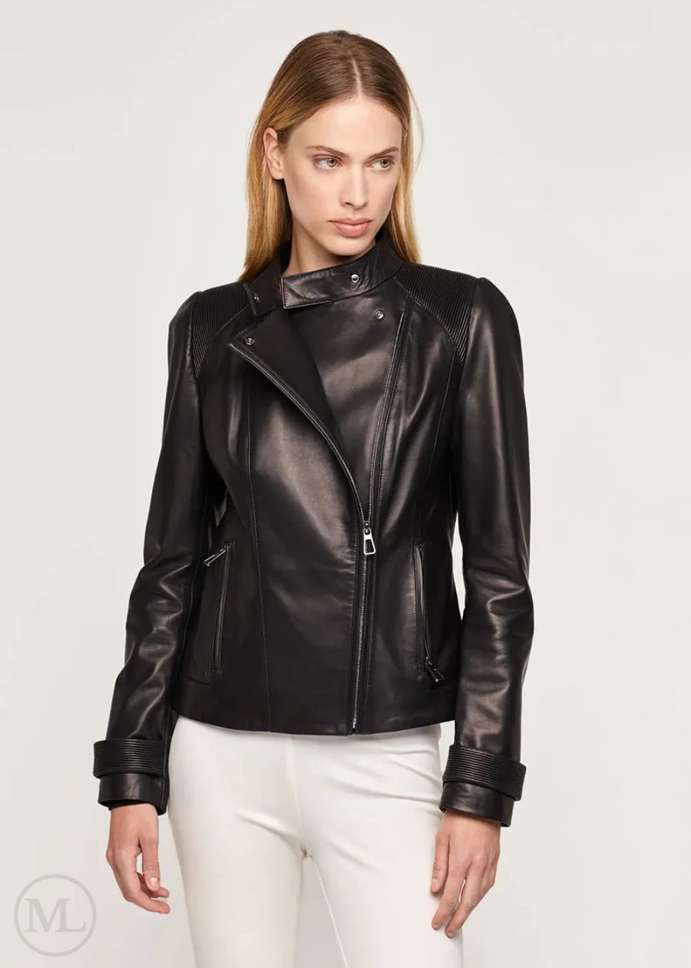 Woman wearing a black leather biker jacket on a white background